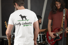Load image into Gallery viewer, Standing man facing bandmates wearing a white shirt with Lucky Labrador logo